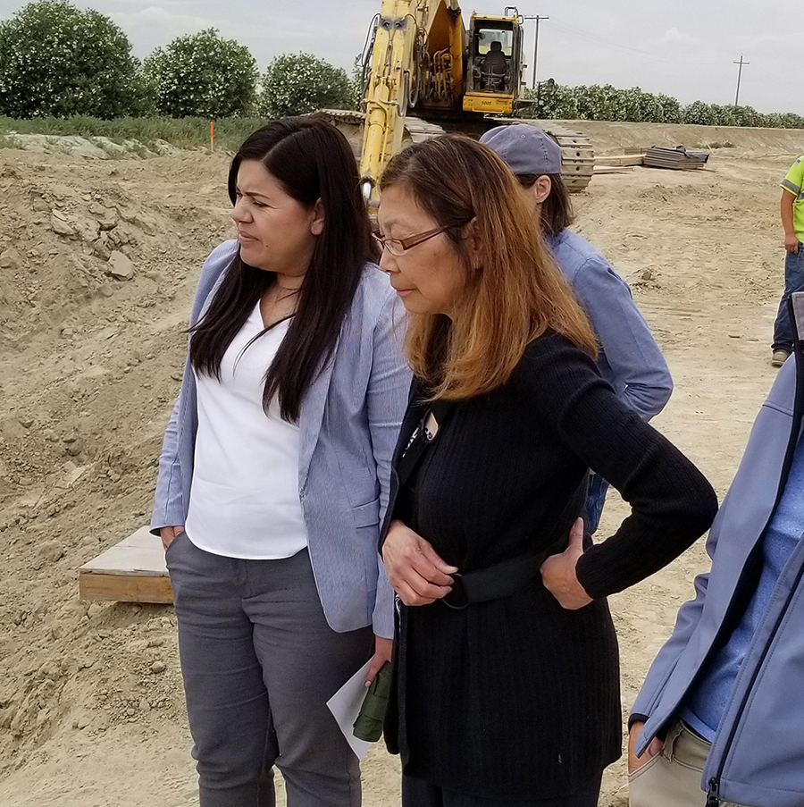California Water Commissioner Maria Herrera, left, and Commission Vice-Chair Carol Baker, second from left, during a tour of the McMullin On-Farm Flood Capture and Recharge Project.