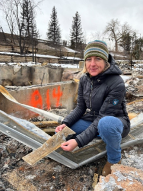 Yana Valachovic, UC ANR Forest Advisor, reviews a home destroyed by wildfire and the foundation vent screen size.