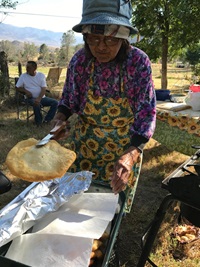 Lena Begay makes fry bread for family and guests of DWR at the Miranda allotment.
