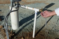 A recently drilled, now operable, water well at Meade Hill Vineyard in Smartsville, Calif. is tested out by owner Mike Lacefield on August 28th, 2015.  