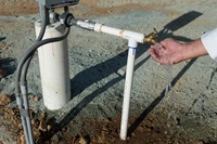 A recently drilled, now operable, water well at Meade Hill Vineyard in Smartsville, Calif. is tested out by owner Mike Lacefield on August 28th, 2015.