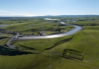 A drone provides a view of water pumped from the Harvey O. Banks Delta Pumping Plant into the California Aqueduct at 9,790 cubic feet per second after January storms. Photo taken January 20, 2023.