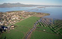 The Sacramento Valley community of Meridian, California, in Sutter County was surrounded by flood waters from the Sacramento River and a break from the west levee of the Sutter Bypass during the January flood of 1997. 