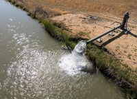 A drone view as groundwater pumping from production wells fill agricultural waterways to irrigate fields at Conaway Ranch in Yolo County.