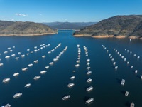 A drone view of Bidwell Canyon Marina and Bidwell Bar Bridge at Lake Oroville in Butte County, California. On this date, the water storage at Lake Oroville was 2,707,699 acre-feet (AF), 77 percent of the total capacity.