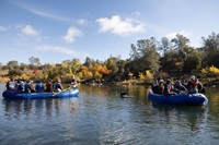 DWR employees participate in a Feather River Floating Classroom tour in Oroville during an environmental sciences workshop, learning about the Fall salmon run. 