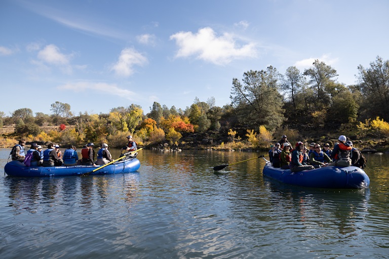 DWR employees participate in a Feather River Floating Classroom tour in Oroville during an environmental sciences workshop, learning about the Fall salmon run. 
