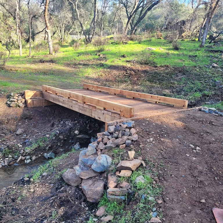 A new wooden foot bridge spans a small stream that cuts through the Brad Freeman Trail near the Hyatt Powerplant. 