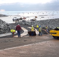 Workers prepare to pour concrete at Bidwell Canyon boat ramp Dec. 17. New paved parking lot in background.
