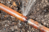 Close-up of a burst water main.