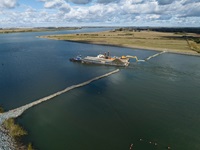 This aerial photograph captured via drone shows construction crews working on removing this Emergency Drought Salinity Barrier on the West False River near Oakley in the Sacramento-San Joaquin Delta in Contra Costa County. The rock barrier was placed to help deter the tidal incursion of saltwater from San Francisco Bay into the central Delta. Photo taken November 2, 2022.