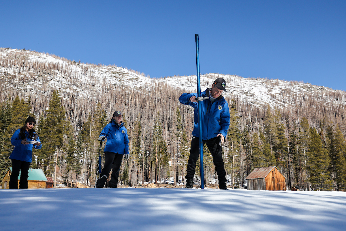 (Left to right) California Department of Water Resources staff Angelique Fabbiani-Leon, State Hydrometeorologist, Jordan Thoennes, Water Resources Engineer, and Andy Reising, Snow Surveys and Water Supply Forecasting Unit Manager, conduct the third media snow survey of the 2025 season at Phillips Station in the Sierra Nevada. The snow survey is held approximately 90 miles east of Sacramento off Highway 50 in El Dorado County. Photo taken February 28, 2025.